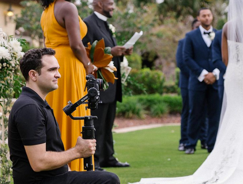 wedding videographer recording an event