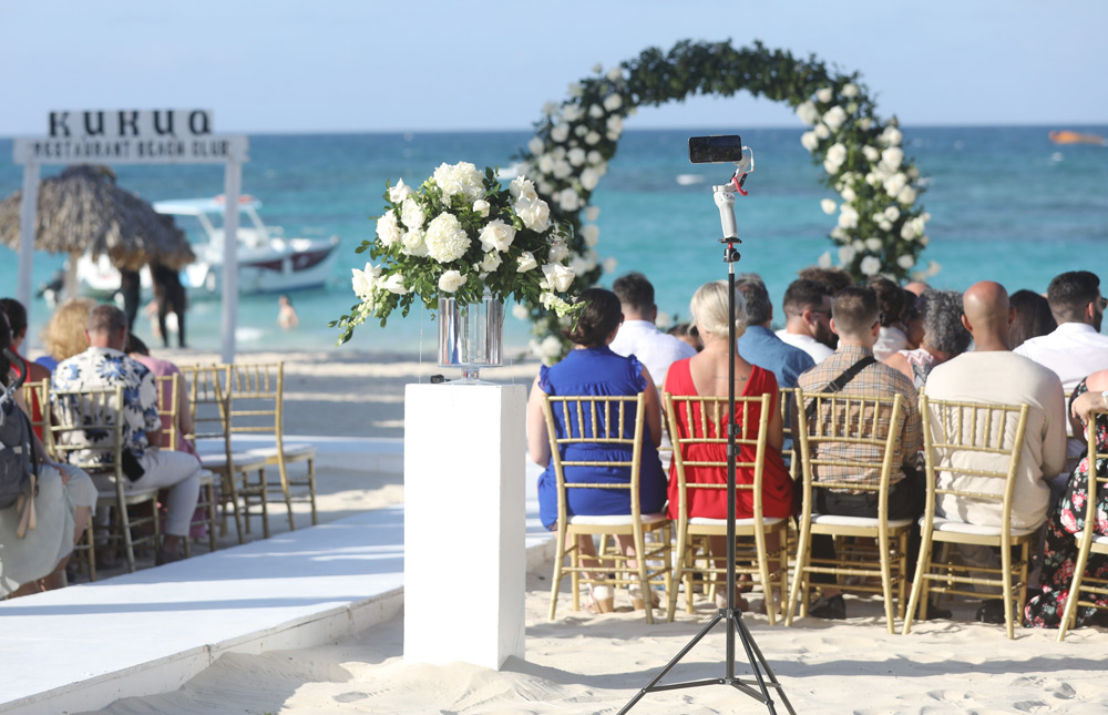 using a phone to livestream a wedding ceremony